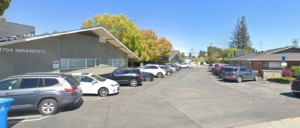 Image of 1704 Miramont from the Street looking into the parking lot