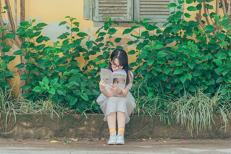 Student reading book 