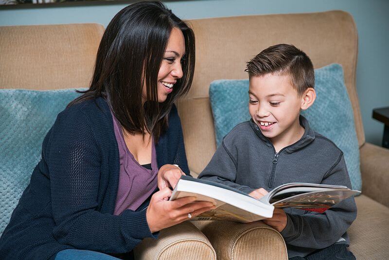 Mother and son reading AJ Tutoring